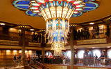 The art deco look and statue of Admiral Donald in the ship's lobby are familiar to past guests.