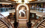 The three-deck Grand Lobby on the Queen Elizabeth, with a mural of the original Queen Elizabeth.