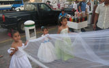 Young girls hold a bride's veil at a street wedding in Acapulco. TW photo by Gay Nagle Myers