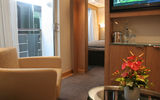 A view of the bedroom from the living room of a 270-square-foot Veranda suite.