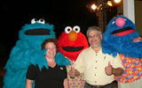 Beaches Resorts’ Sesame Street characters greet Denise and Paul Hangsbleden, Travel Your Way, Belleville, Mo.