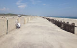 After about three hours, work on snow fencing is completed along a one-mile stretch of beach at Fort Tilden.