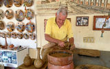 Azariel Santander Alcantera, a celebrated potter in the town of Trinidad, demonstrates his talent at his pottery wheel.
