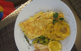 Haitian cuisine stems from French, African, the Spanish Taino Amerindians and Middle Eastern influences with lots of herbs and peppers used in many dishes. The Haitian omelet, above, is accompanied by fried plantains and pain Haitian (Haitian bread) . Photo by Gay Nagle Myers