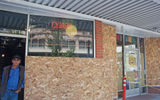 Retail stores such as this cigar shop along Napa's First Street were boarded up and closed on Monday as shop owners assessed the quake damage.