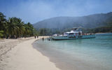 A catamaran brings passengers to a secluded Caribbean island for snorkeling and swimming during a Star Clippers cruise.