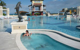 The main pool area at Sandals Emerald Bay is one acre in size, including a pool deck and swim-up bar area.