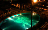 The pool is the focal point of the Halekulani grounds, even at night.