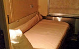The bedroom for one is comfortable and has all the necessities with no room to spare.