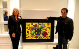 The Allure of the Seas will feature the first Romero Britto gallery at sea. Above, the artist poses with Lisa Bauer.