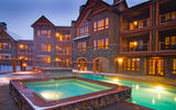 At the newly built, luxury ski in/ski out BlueSky Condos resort, the outdoor pool and hot tubs area offer views of the town of Breck and the Rocky Mountains.