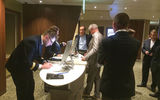 The traditional shore excursion desk has been reduced to tables with monitors. Customers use tablets to review shore options and purchase excursions.