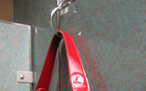 The Clipa comes in handy in restaurant, airport, airline, hotel and cruise ship lavatories, as well as in public spaces such as casinos and theaters where the user wants to keep her handbag accessible but off the floor. It attaches to a bag's straps so that it looks like it was designed as an accent feature, comes with an automatic closure system and is attractive enough to be worn as a bracelet if so desired.
