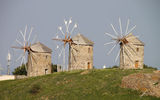 Windmills seen on the island of Patmos. While Mykonos is famous for its windmills, the mills are scattered throughout many Greek islands.