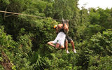 Guides help participants get acrobatic on the zip-line at Selvatica.