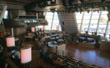 A daytime view of the Two70 lounge at the aft of Quantum of the Seas. The new, dual-use space is intended as a library/bar/cafe hangout during the day, mixed with special programming.