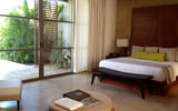 The bedroom of a Rosewood Mayakoba lagoon suite.