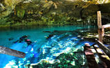 Snorkelers getting in at Dos Ojos, a popular snorkeling cenote and one used by Hidden Worlds.