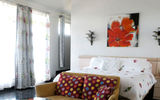 The master bedroom at Exclusivity has ocean views, a private patio and two full bathrooms.