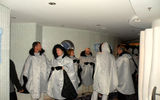 Passengers line up and don parkas to experience the only ice bar at sea.