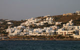 View of Mykonos houses and bay. The Greek island manages to preserve its charms despite the fact it sometimes fills up with very large numbers of tourists.