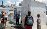 Tours of New Orlean's aboveground cemeteries are popular. Here, a group visits the tomb of renowned 19th century Voodoo Queen Marie Laveau.