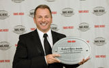 Chris Austin of Starwood accepts one award each for Starwood and for Westin. (photo by Steve Hockstein/Harvard Studio)