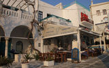 A cafe on the island of Mykonos. Its proprietor stepped into the square to pitch for business.