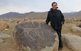 Patricia Schultz, author of ''1,000 Places to See Before You Die,'' with petroglyphs in Kyrgyzstan.