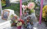 Mementoes and photos left on a gravesite at the cemetery.