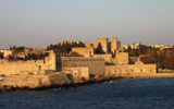 An early morning view of the 14th century walls -- built by crusading knights -- that surround Rhodes, the capital city of the island of Rhodes. The Palace of the Grand Masters is visible slightly to the right of center.