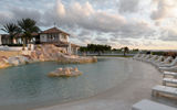 At Sandy Line, a St. Martin villa perched on a mountainside overlooking the sea, the descending pool is meant to offer the feel of the beach.