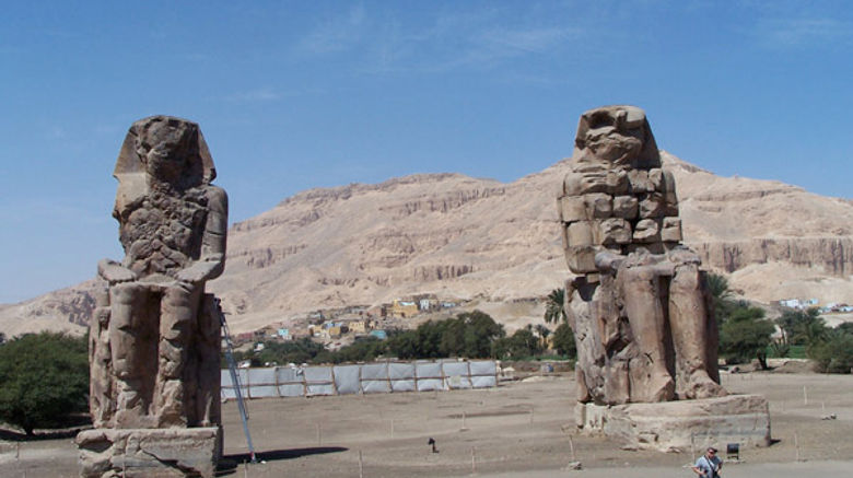 Archeologists recently discovered two new ancient statues near the much-visited Colossi of Memnon, pictured, near Luxor.