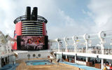 The pool deck is surrounded by the AquaDuck WaterCoaster, a tamer waterslide for younger kids and Mickey's Pool.