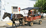Transportation within Cuba takes many forms, including horse-drawn carriages that carry produce and passengers.