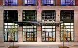 The Crosby Street Hotel, situated on a quiet cobbled street, features an elevator notable for having a picture-collage tribute to the local neighborhood dogs.