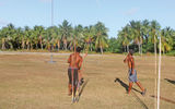 At a local park in Avatoru, a javelin thrower fires at a round disc mounted on a pole, 20 yards away.