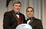 Travel Weekly Publisher Bob Sullivan, left, presents the Domestic Airline Award to American Airlines district sales manager Shasi Khemlani. (photo by Lisa Quinones/Black Star)