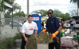 Steve Joyce, president and CEO, Choice Hotels International (left), and Brandon Jones, San Francisco 49ers, lend a hand with landscaping at Kickoff To Rebuild 2010.