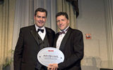 Chris Rossi, SVP of Virgin Atlantic, left, accepts the International Airline Award from Travel Weekly Editor in Chief Arnie Weissmann. (photo by Lisa Quinones/Black Star)