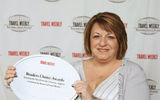 Gogo Worldwide Vacations President Michele Kish accepted her company's Best Domestic Tour Operator and Best in the Caribbean awards.