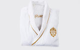 The next best thing to actually overnighting at the fabled Plaza Hotel could be wearing this lavish terry robe in your own home. The robe, which sports gold trim and the gold embroidered crest of the hotel, comes in sizes ranging from small to XXL. It is available from the Plaza Boutique, which specializes in accessories and apparel made exclusively for The Plaza Hotel.