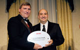 Scott Wiseman, right, president of Abercrombie & Kent, accepts the award for Best Luxury Tour Operator from Bob Sullivan of Travel Weekly. (photo by Lisa Quinones/Black Star)