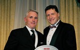 Jeff Mullen of Apple Vacations, left, accepts the Best in Mexico award from Arnie Weissmann, editor in chief of Travel Weekly. (photo by Lisa Quinones/Black Star)