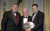 Jesse Upchurch, center, accepts the 2008 Lifetime Achievement Award from Bob Sullivan, left, and Arnie Weissmann. (photo by Lisa Quinones/Black Star)