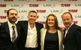 Family owners celebrate the signing of the MOU that outlines the intentions of Lan Airlines and Tam merge. (L-R): Mauricio Rolim Amaro, vice chairman of the TAM board of directors; Enrique Cueto, LAN CEO; Maria Claudia Amaro, chairman of the TAM board; and Ignacio Cueto, LAN president/COO.