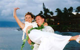 Mark and Michelle Smith get carried away at Napili Bay Beach, Maui. (photo courtesy of Hawaiian Island Weddings)