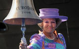 The Eurodam's godmother, Her Majesty Queen Beatrix of The Netherlands, rings a bell to officially name the vessel.