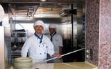 A pizza chef at Slice, a new pizza counter that made its debut for HAL on the Eurodam's aft pool deck, is ready to serve up a pie. (photo by Johanna Jainchill)