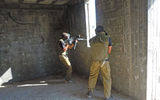 Players take aim at the "enemy" during the two-hour Ultimate Showdown paintball match at LionOps' West Bank facility that wrapped up Kiesnoski's training experience